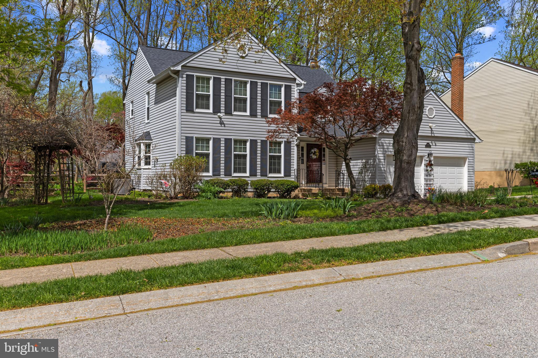 6030 Watch Chain Way Columbia, MD 21044 - Photo 3 of 90 a front view of a house with a yard