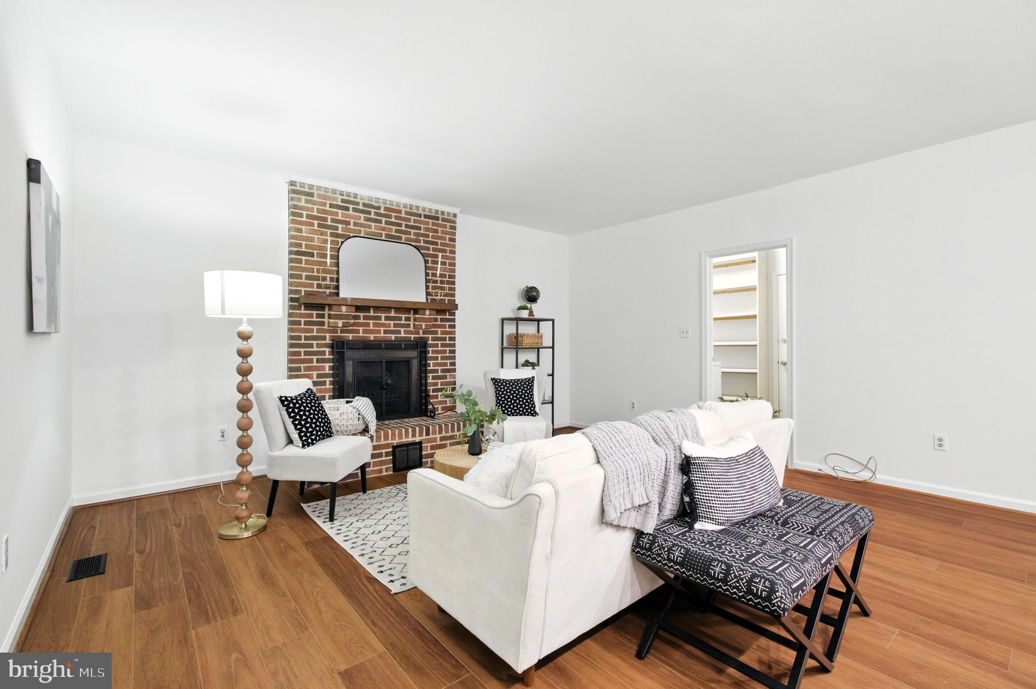 6030 Watch Chain Way Columbia, MD 21044 - Photo 33 of 90 a living room with furniture and a fireplace