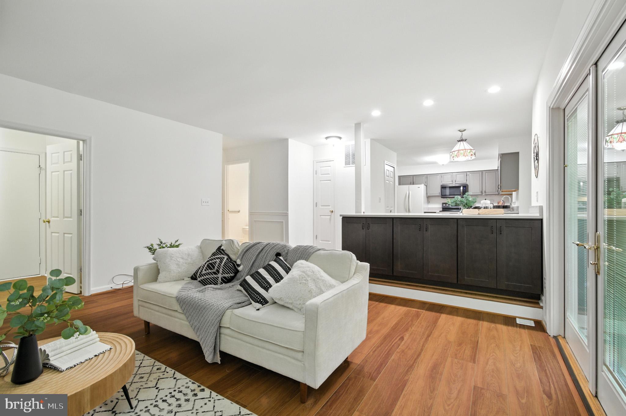 6030 Watch Chain Way Columbia, MD 21044 - Photo 34 of 90 a living room with furniture and a wooden floor