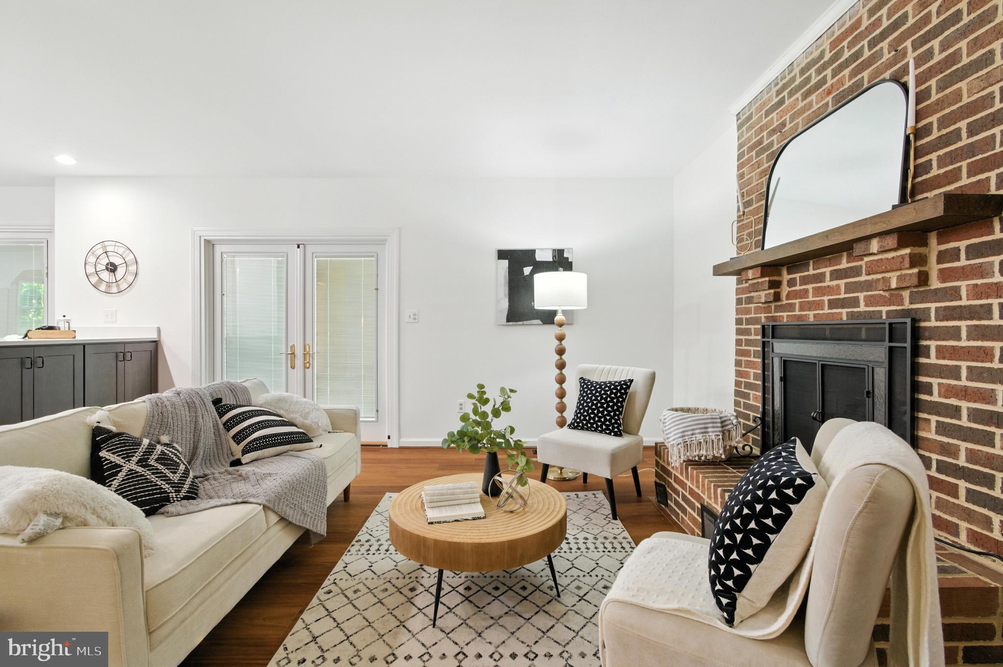 6030 Watch Chain Way Columbia, MD 21044 - Photo 38 of 90 a living room with furniture and a fireplace