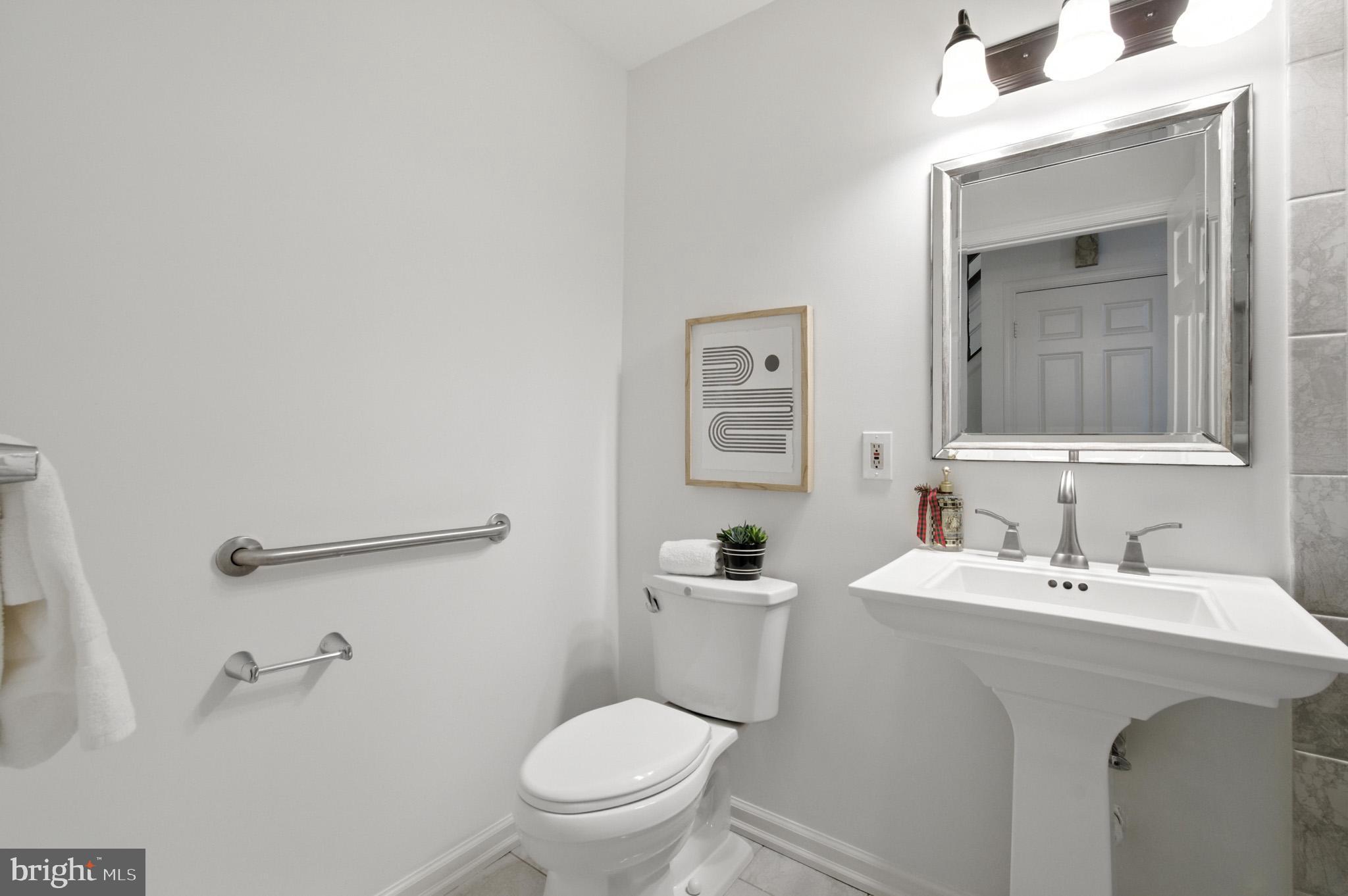 6030 Watch Chain Way Columbia, MD 21044 - Photo 40 of 90 a bathroom with a sink mirror and toilet