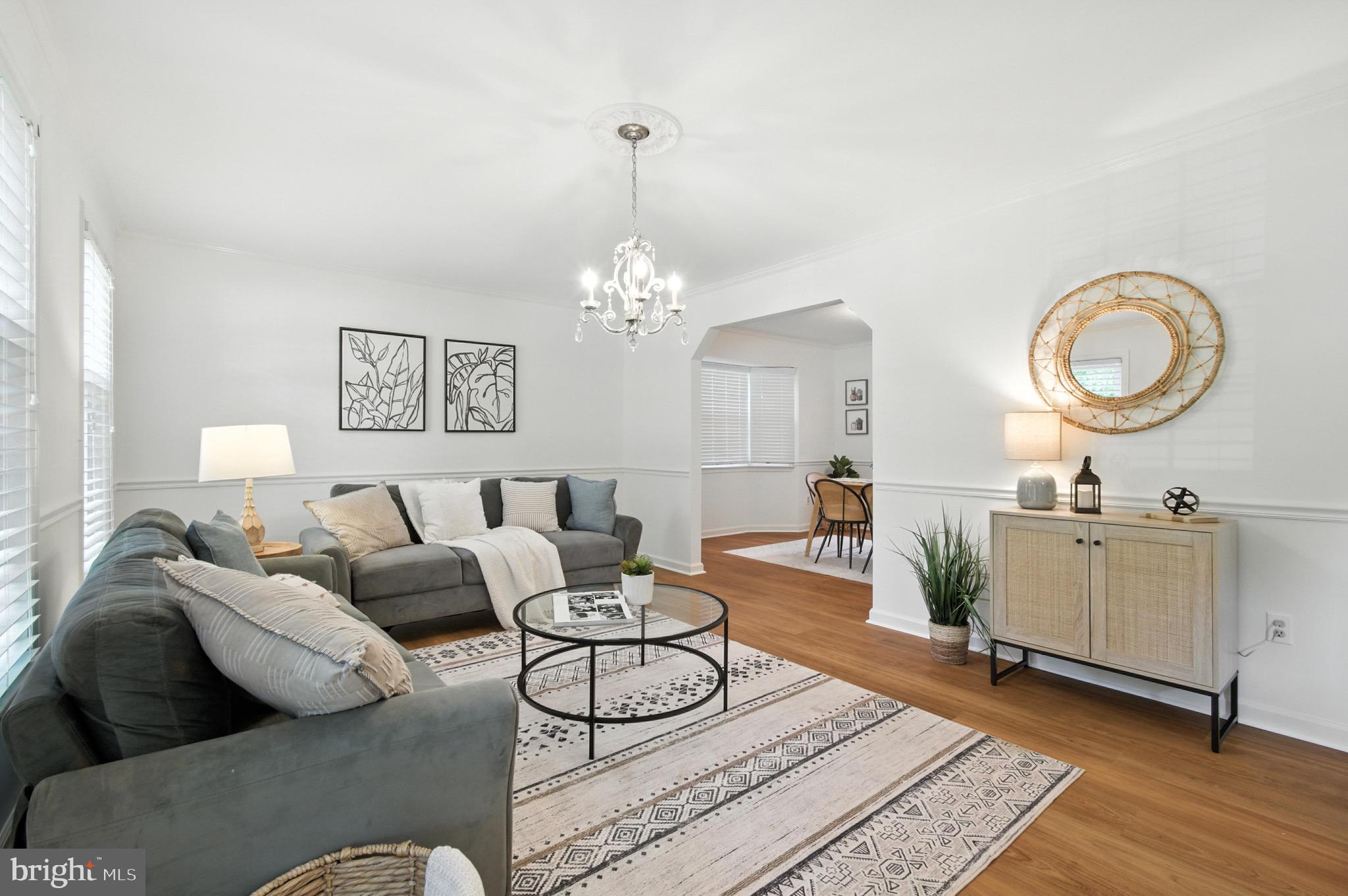 6030 Watch Chain Way Columbia, MD 21044 - Photo 4 of 90 a living room with furniture a chandelier and a rug