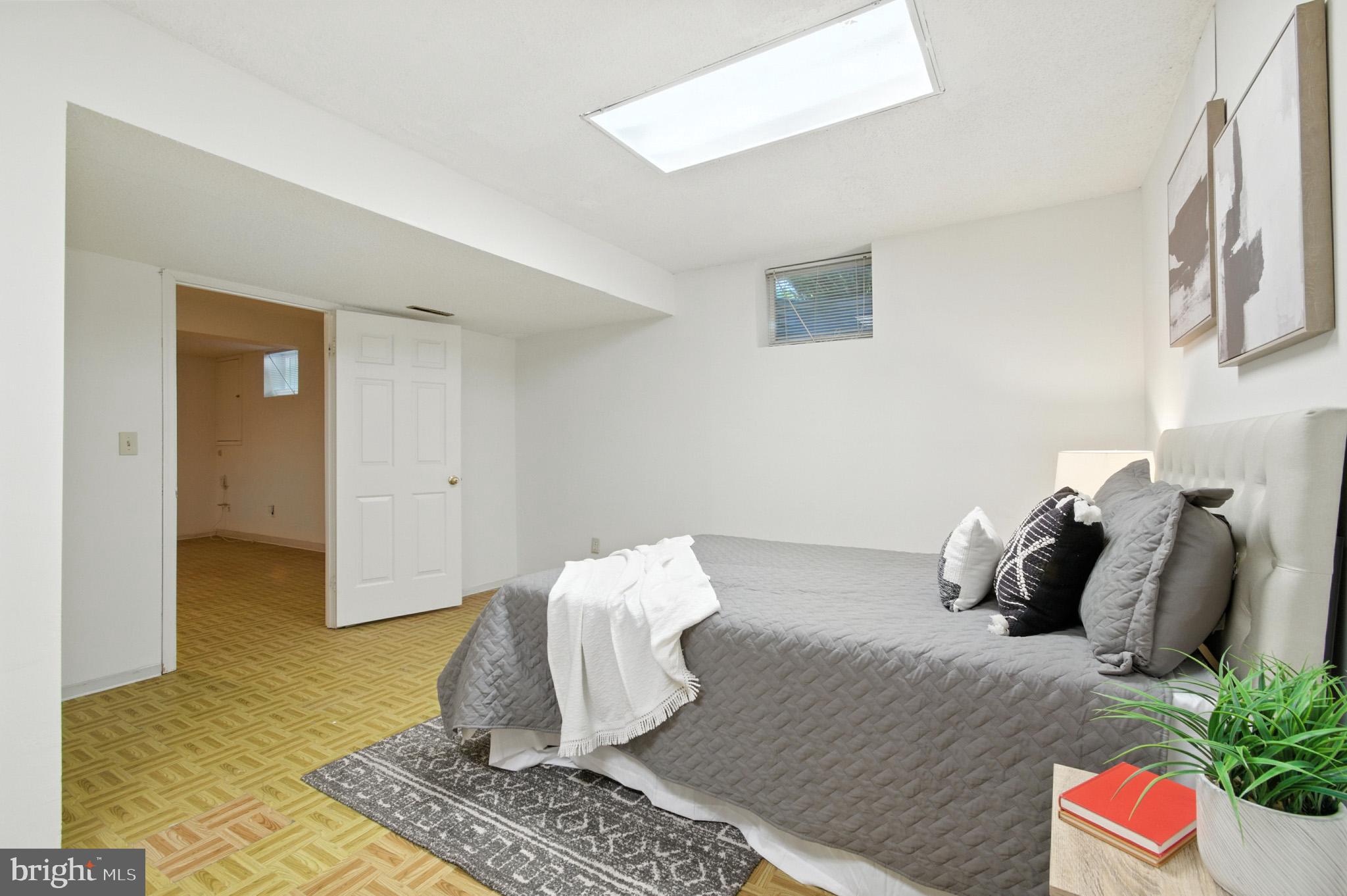 6030 Watch Chain Way Columbia, MD 21044 - Photo 51 of 90 a bedroom with a bed and a potted plant