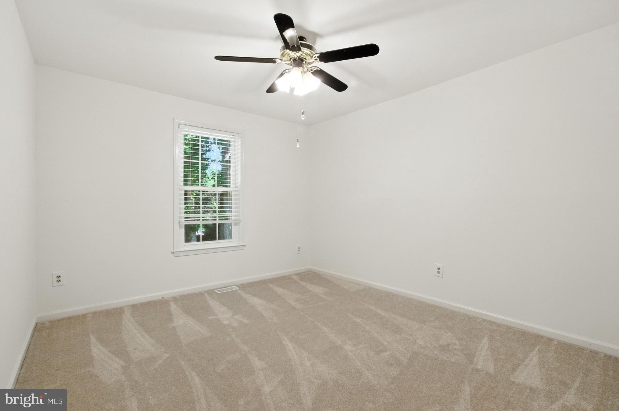 6030 Watch Chain Way Columbia, MD 21044 - Photo 56 of 90 an empty room with ceiling fan and windows