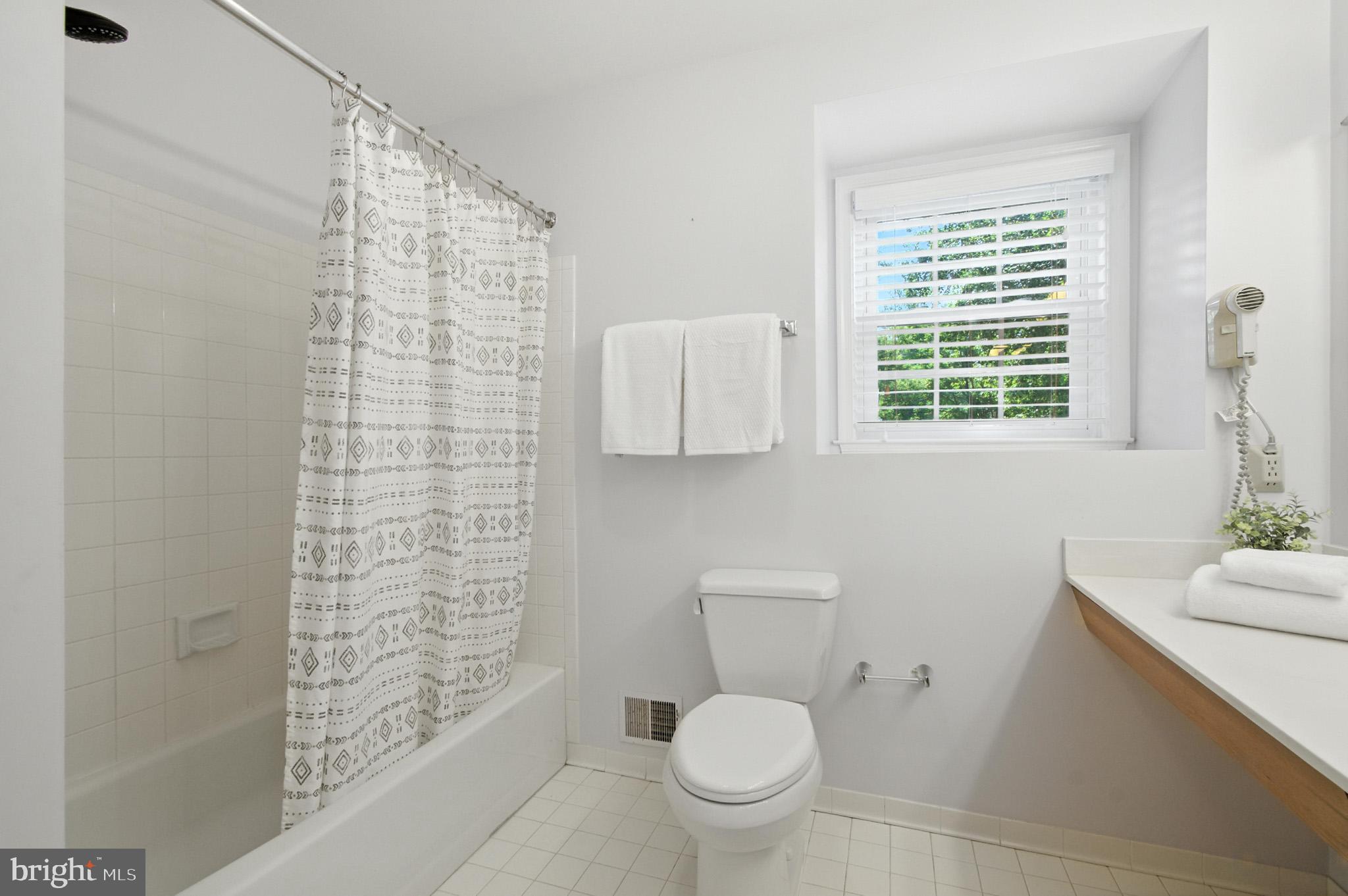 6030 Watch Chain Way Columbia, MD 21044 - Photo 58 of 90 a bathroom with a toilet a sink and a shower