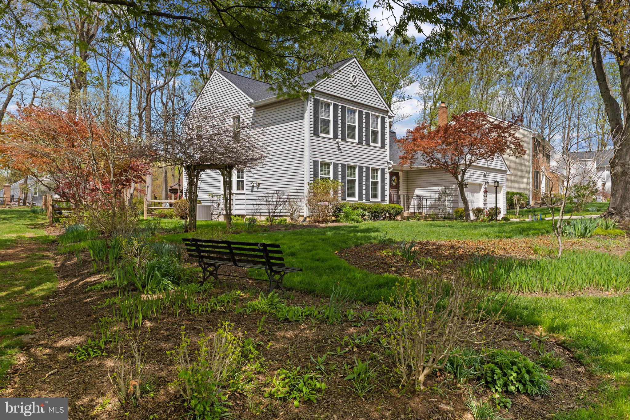 6030 Watch Chain Way Columbia, MD 21044 - Photo 67 of 90 a front view of a house with a yard table and chairs