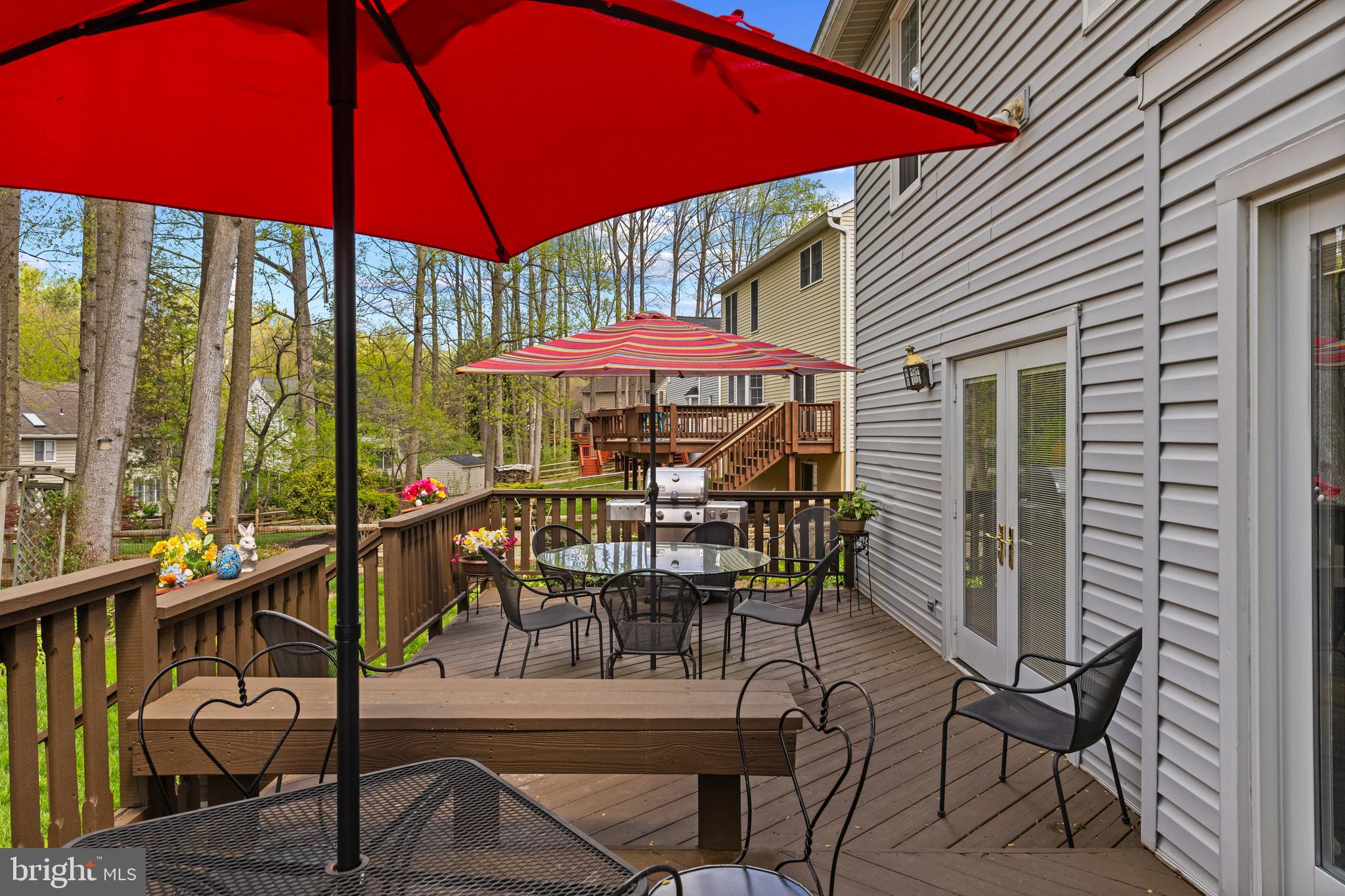 6030 Watch Chain Way Columbia, MD 21044 - Photo 83 of 90 a table and chairs under an umbrella