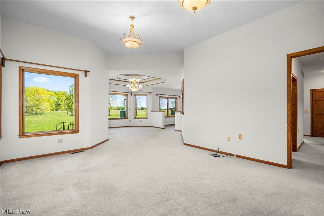51488 Peck Wadsworth Road Wellington, OH 44090 - Photo 19 of 50 Spacious interior with neutral carpeting and white walls