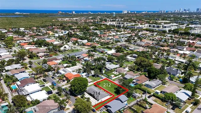 an aerial view of residential building with green space