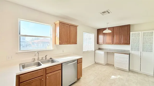 a kitchen with a sink and cabinets