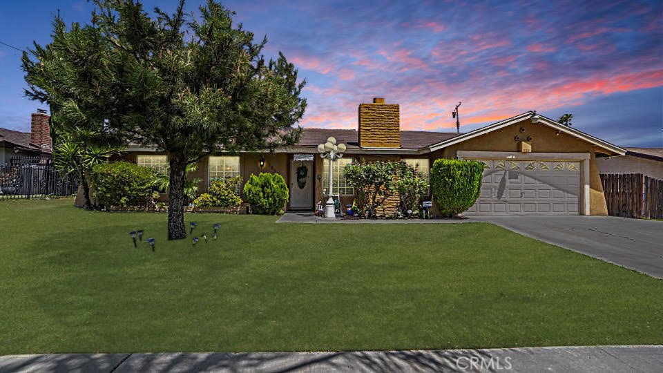 1851 North Vista Avenue Rialto, CA 92376 - Photo 1 of 1 a front view of a house with garden
