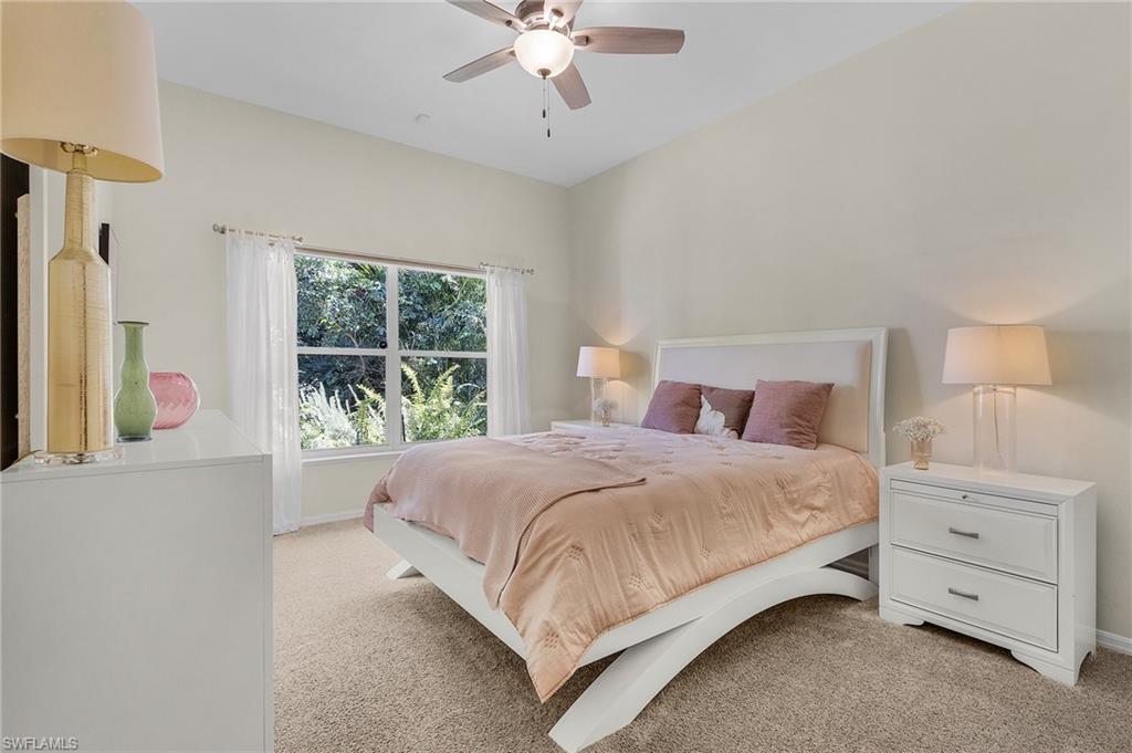 258 Monterey Drive Naples, FL 34119 - Photo 14 of 36 a bedroom with a bed and a window