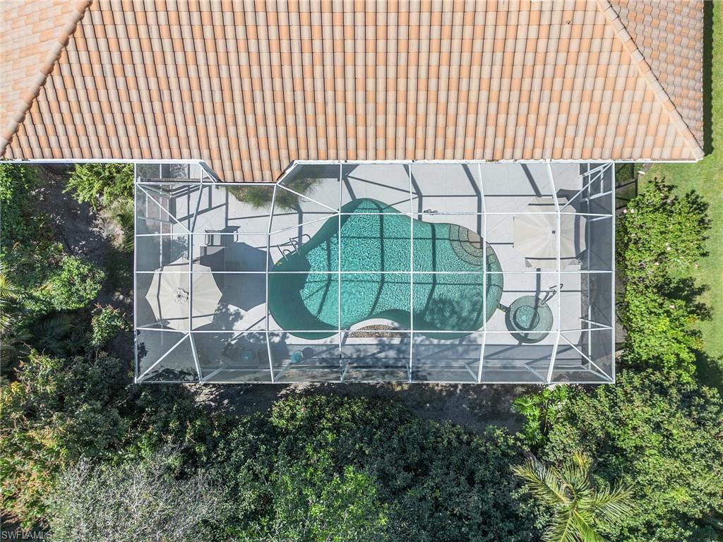 258 Monterey Drive Naples, FL 34119 - Photo 27 of 36 an aerial view of a house with a garden and swing