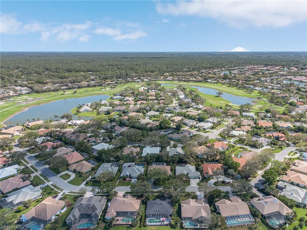 258 Monterey Drive Naples, FL 34119 - Photo 31 of 36 an aerial view of residential building and lake