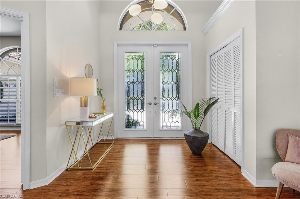 258 Monterey Drive Naples, FL 34119 - Photo 4 of 36 a view of an entryway with wooden floor