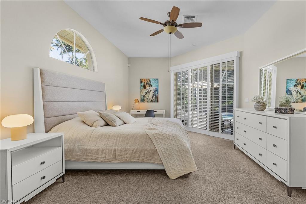 258 Monterey Drive Naples, FL 34119 - Photo 10 of 36 a bedroom with a large bed and a window