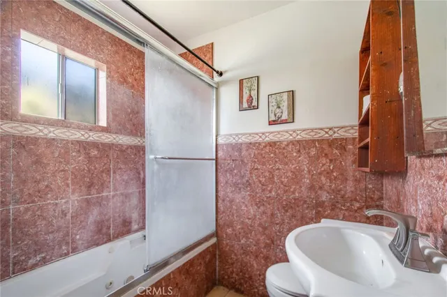 a bathroom with a toilet and a sink