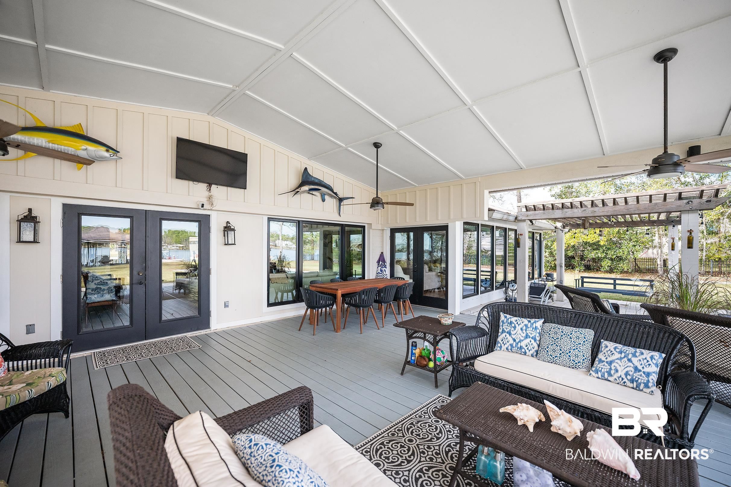 8490 Bay View Drive Foley, AL 36535 - Photo 16 of 67 Wooden terrace featuring an outdoor living space, a ceiling fan, and french doors