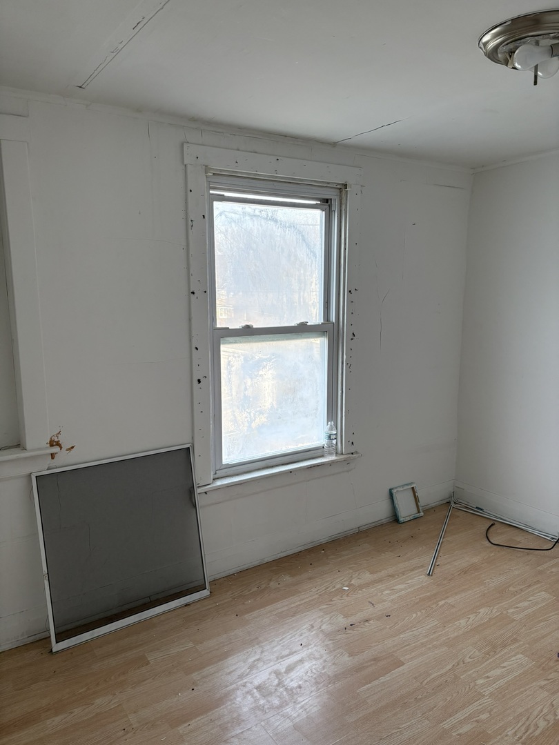 2014 West 52nd Street Chicago, IL 60609 - Photo 12 of 35 an empty room with a window