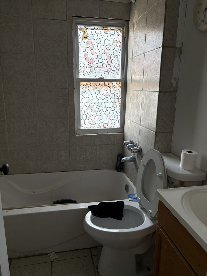 2014 West 52nd Street Chicago, IL 60609 - Photo 16 of 35 a bathroom with a sink and a toilet