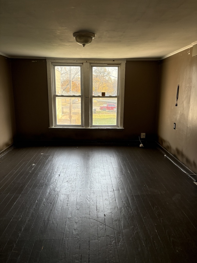 2014 West 52nd Street Chicago, IL 60609 - Photo 17 of 35 an empty room with wooden floor and windows