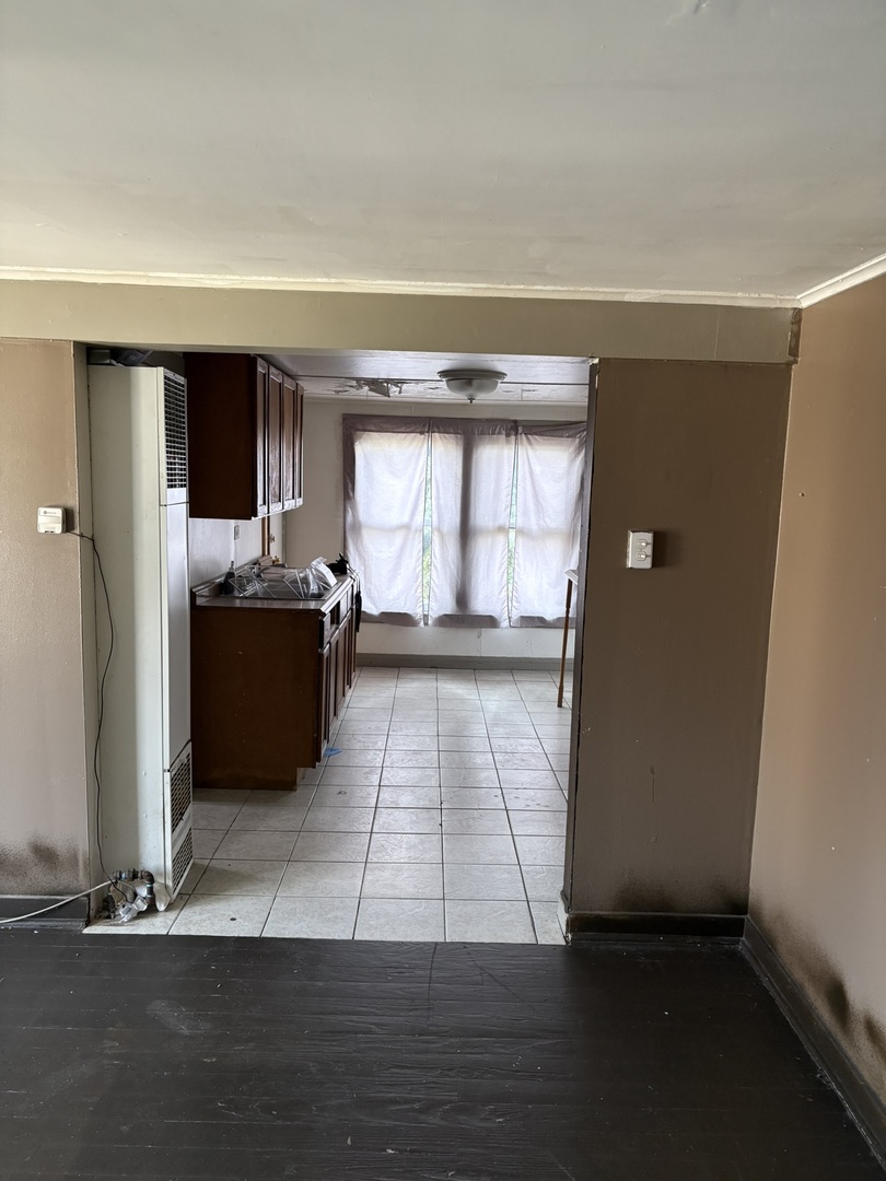 2014 West 52nd Street Chicago, IL 60609 - Photo 22 of 35 a view of a refrigerator in kitchen and wooden floor