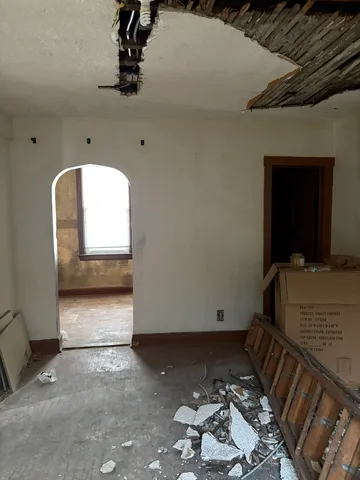 a view of a livingroom with furniture and cabinet
