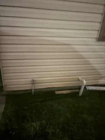 a kitchen with a refrigerator and a sink