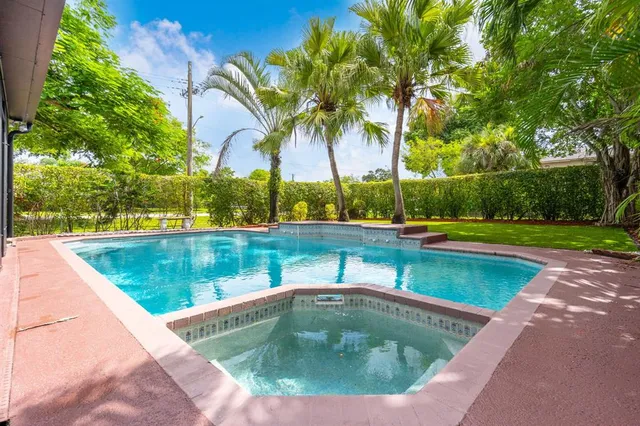 a view of swimming pool with a yard