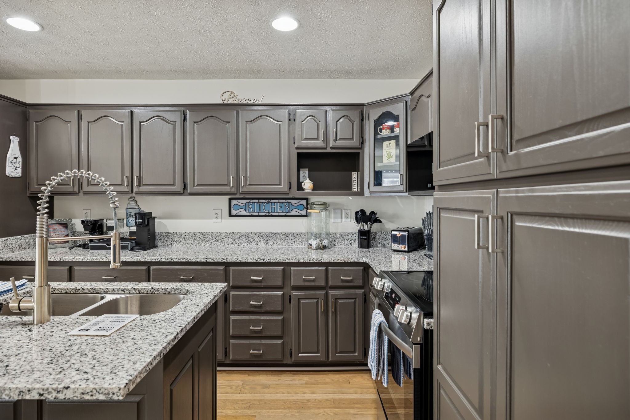 814 Denning Ford Road Portland, TN 37148 - Photo 17 of 99 a kitchen with stainless steel appliances granite countertop a sink stove and refrigerator