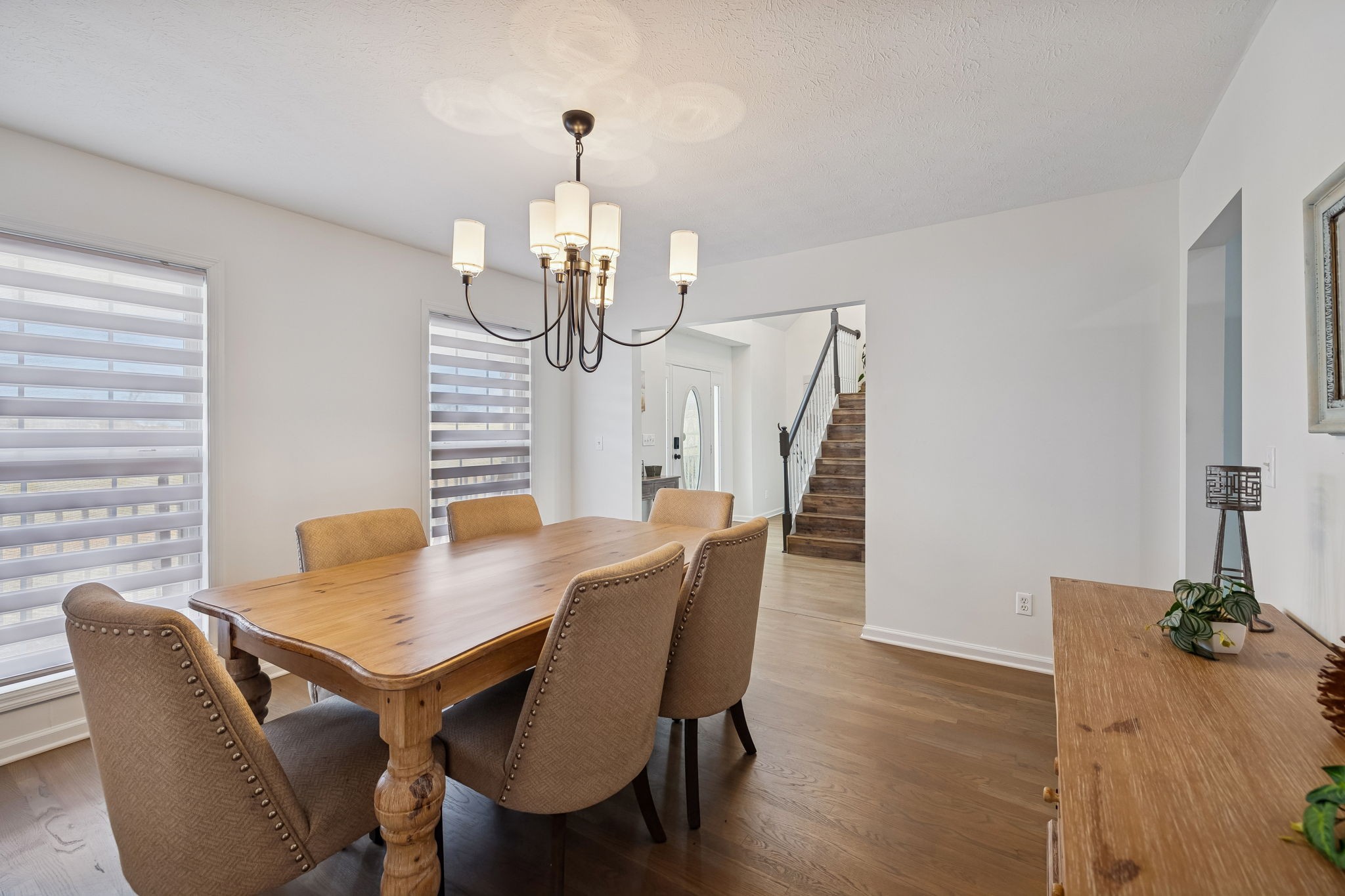 814 Denning Ford Road Portland, TN 37148 - Photo 24 of 99 a view of a dining room with furniture wooden floor and chandelier