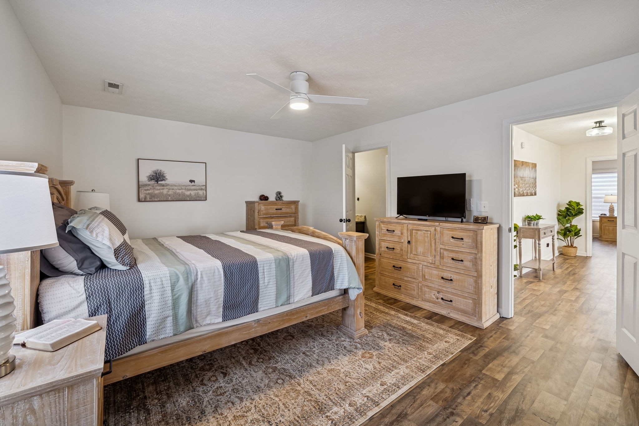 814 Denning Ford Road Portland, TN 37148 - Photo 41 of 99 a spacious bedroom with a bed and a flat screen tv