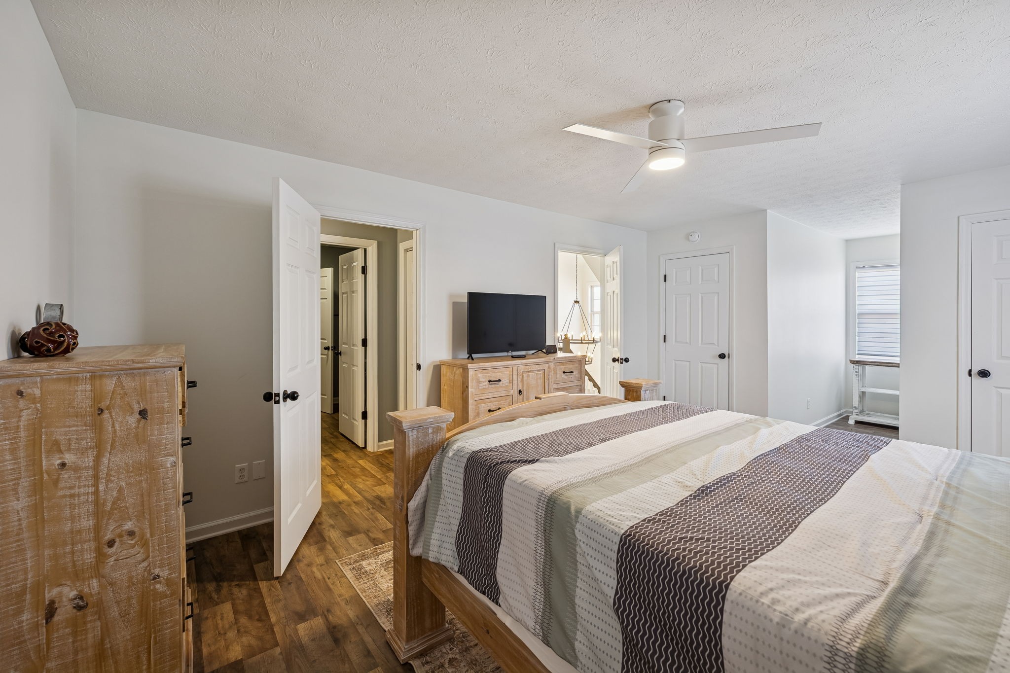 814 Denning Ford Road Portland, TN 37148 - Photo 42 of 99 a bedroom with a bed and a flat screen tv