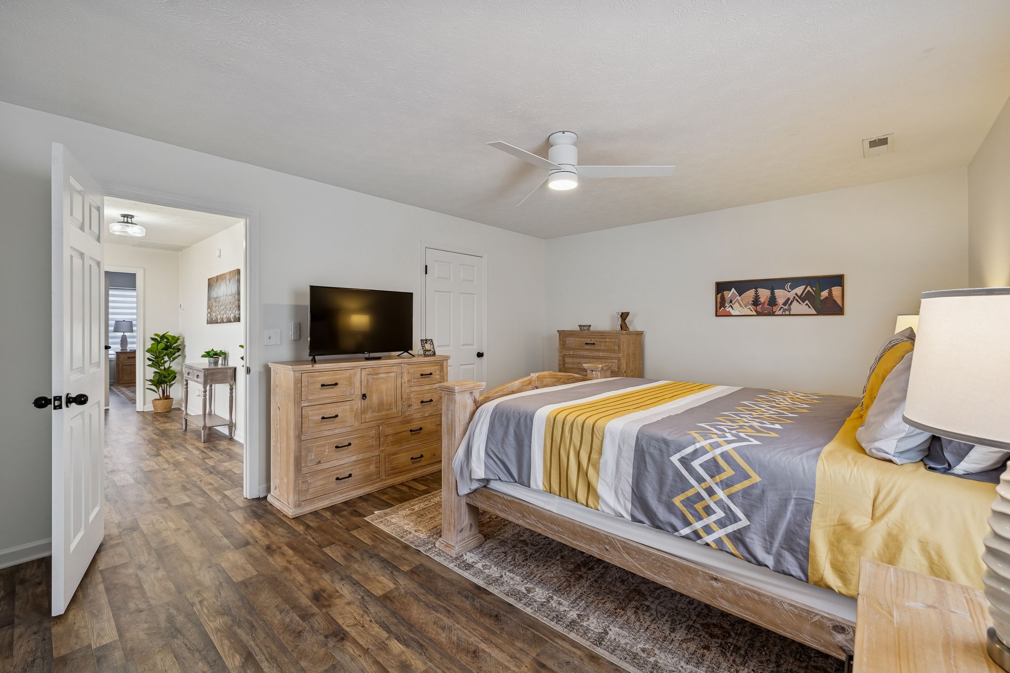 814 Denning Ford Road Portland, TN 37148 - Photo 47 of 99 a spacious bedroom with a bed and a flat screen tv