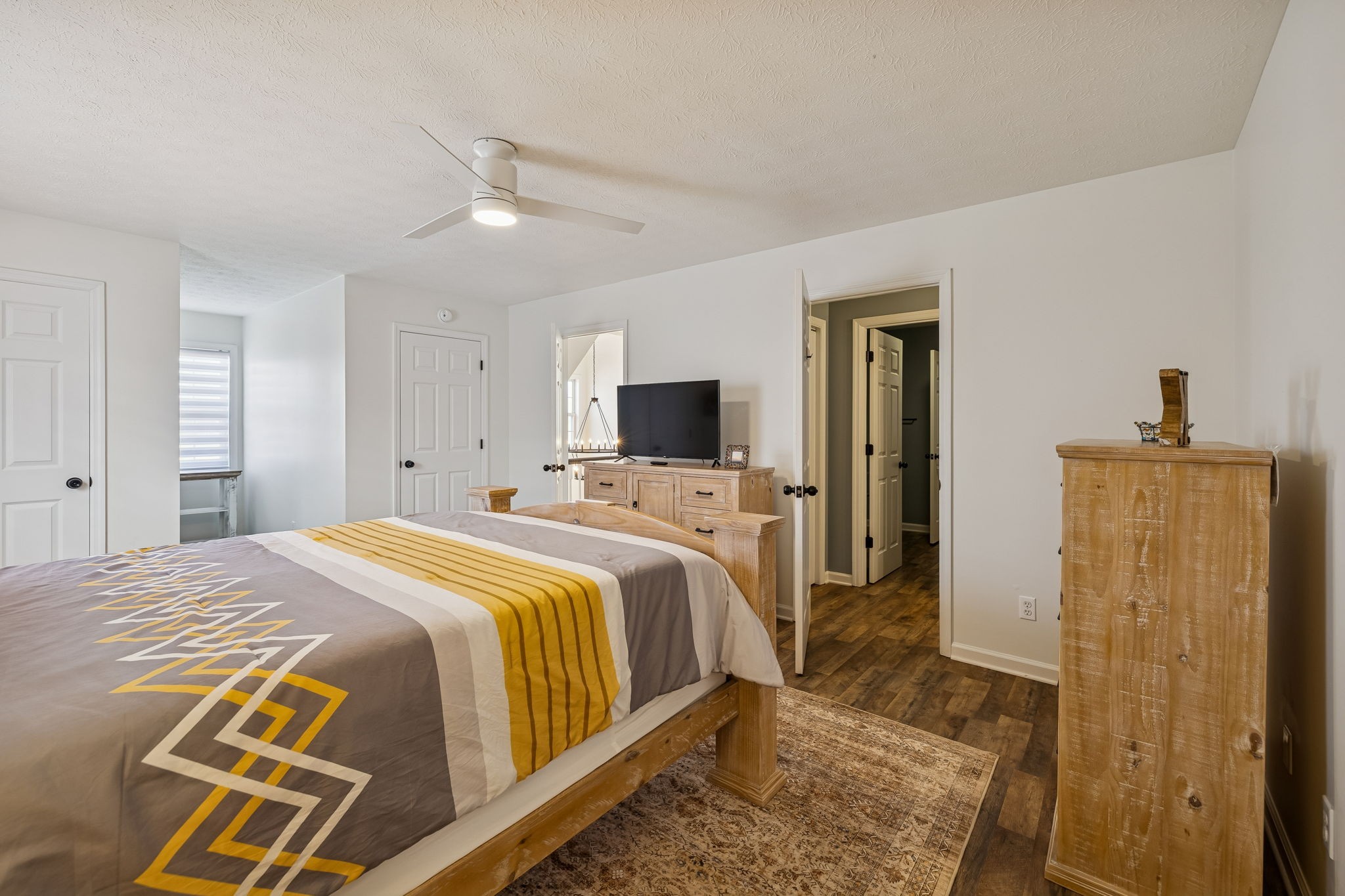 814 Denning Ford Road Portland, TN 37148 - Photo 48 of 99 a bedroom with a bed and a flat screen tv