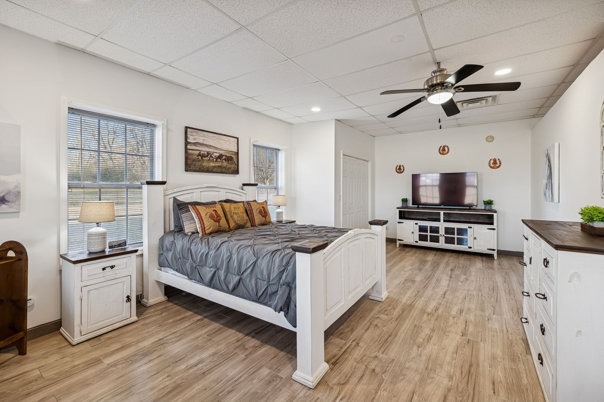 814 Denning Ford Road Portland, TN 37148 - Photo 62 of 99 a bedroom with a bed and a chandelier