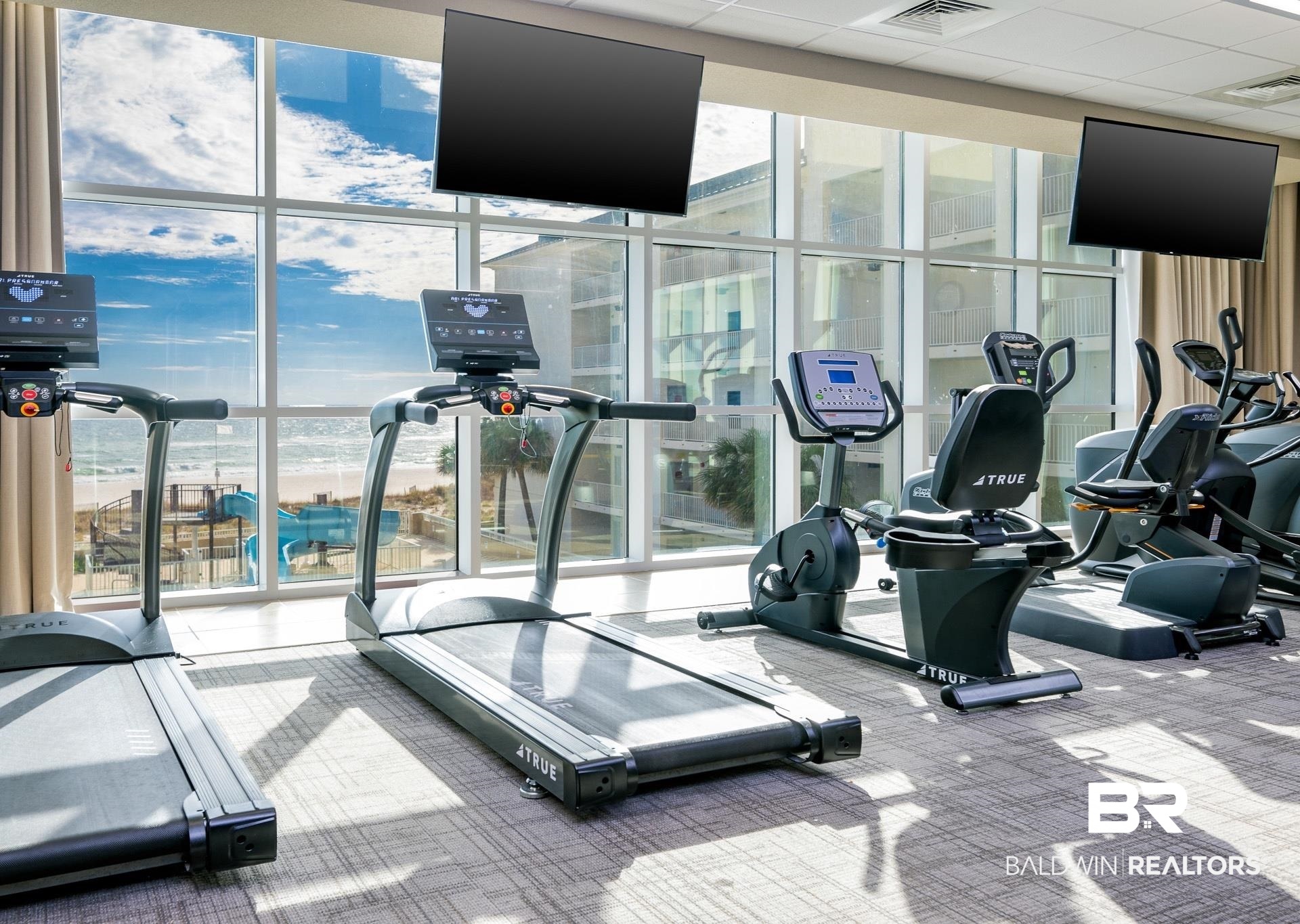 23008 Perdido Beach Boulevard, Unit 506 Orange Beach, AL 36561 - Photo 43 of 48 Workout area with carpet flooring, expansive windows, and visible vents