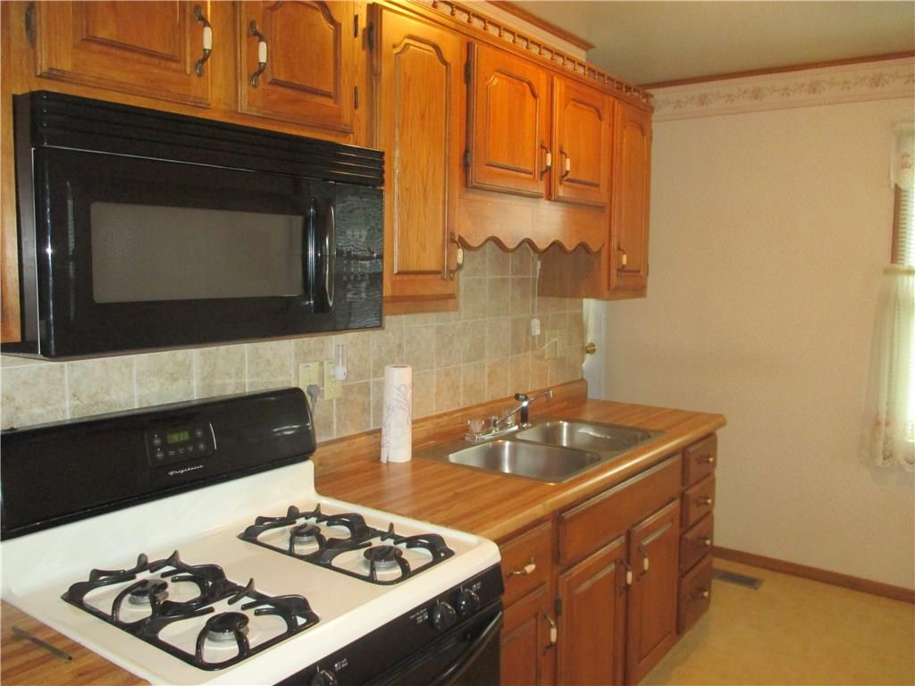 326 Spruce Street Beaver, PA 15009 - Photo 3 of 20 Updated kitchen with tile back splash