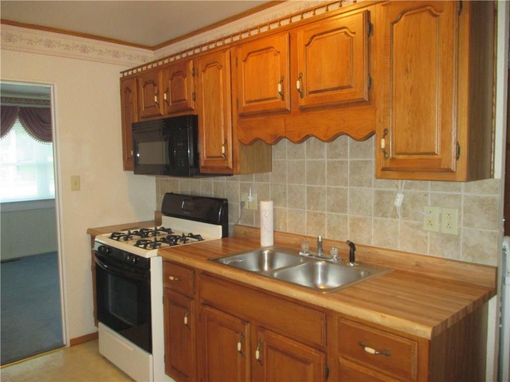326 Spruce Street Beaver, PA 15009 - Photo 4 of 20 Kitchen with butcher block counter tops and tile back splash
