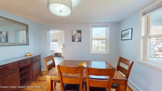 a dining room with furniture and window