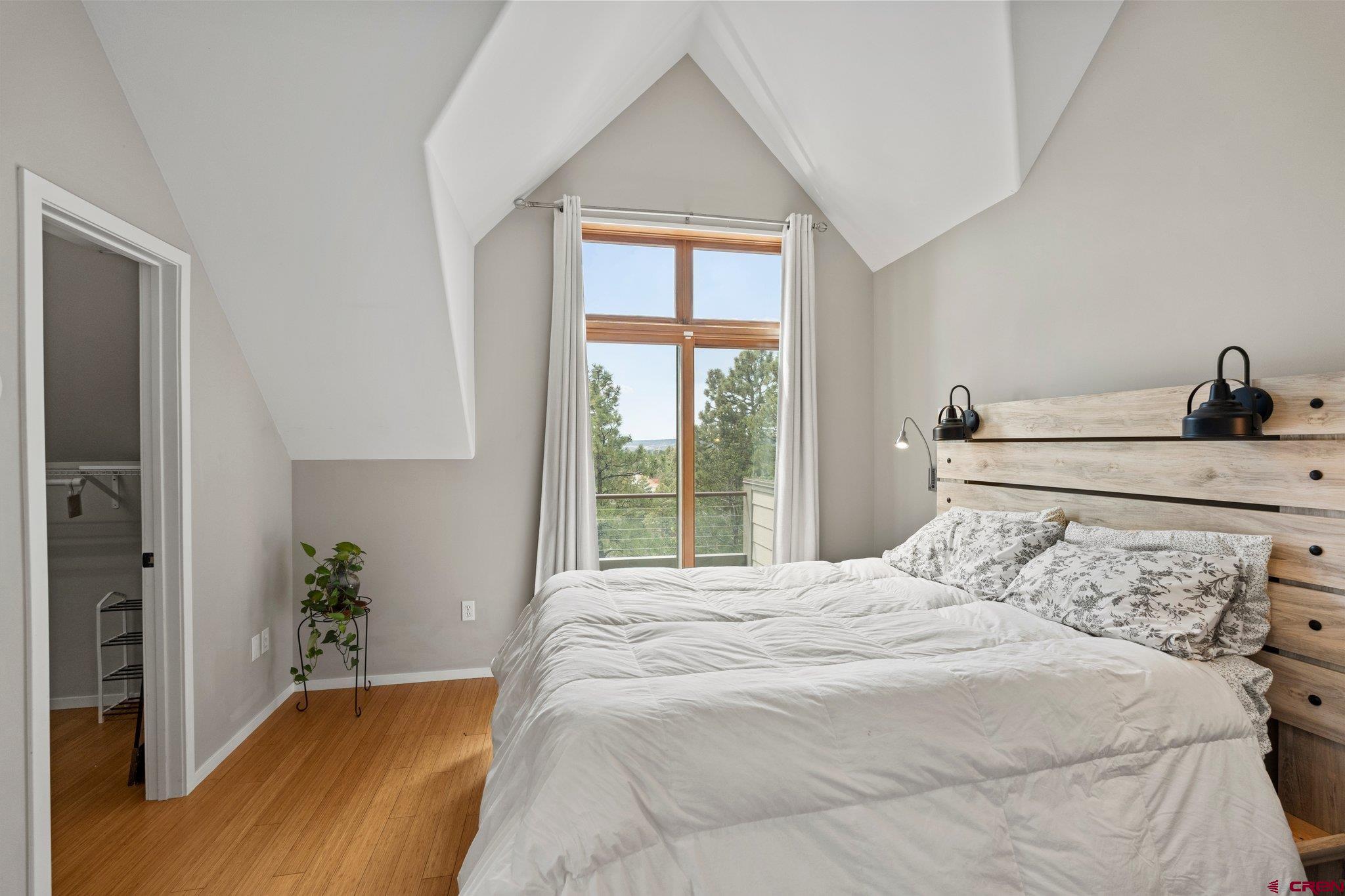 855 Ridge Road Durango, CO 81303 - Photo 11 of 35 a bedroom with a bed and a window