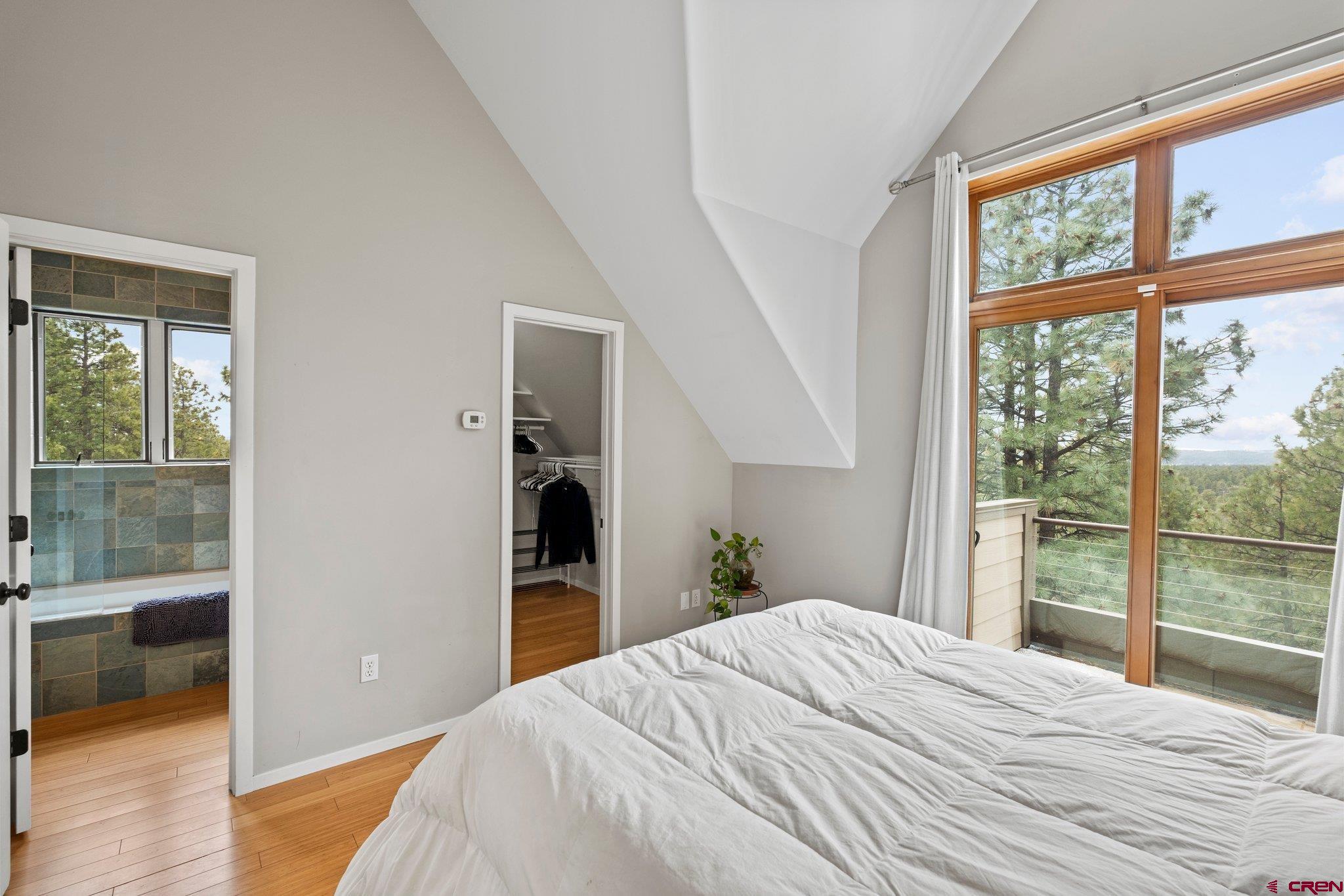 855 Ridge Road Durango, CO 81303 - Photo 12 of 35 a bedroom with a bed and a large window