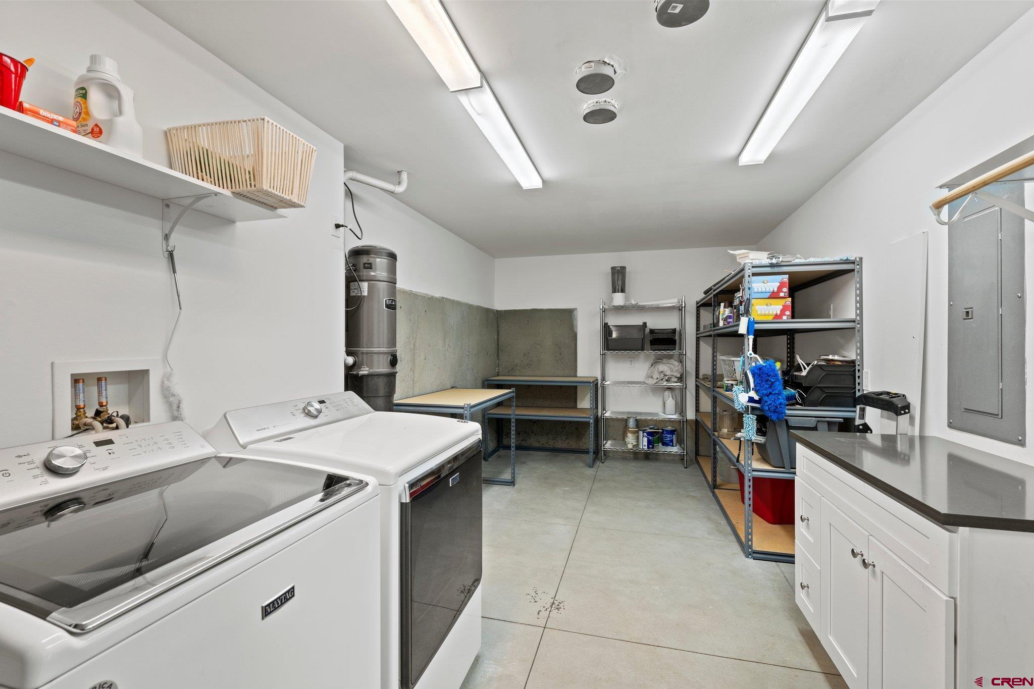855 Ridge Road Durango, CO 81303 - Photo 23 of 35 a kitchen that has a lot of cabinets a sink and a stove in it