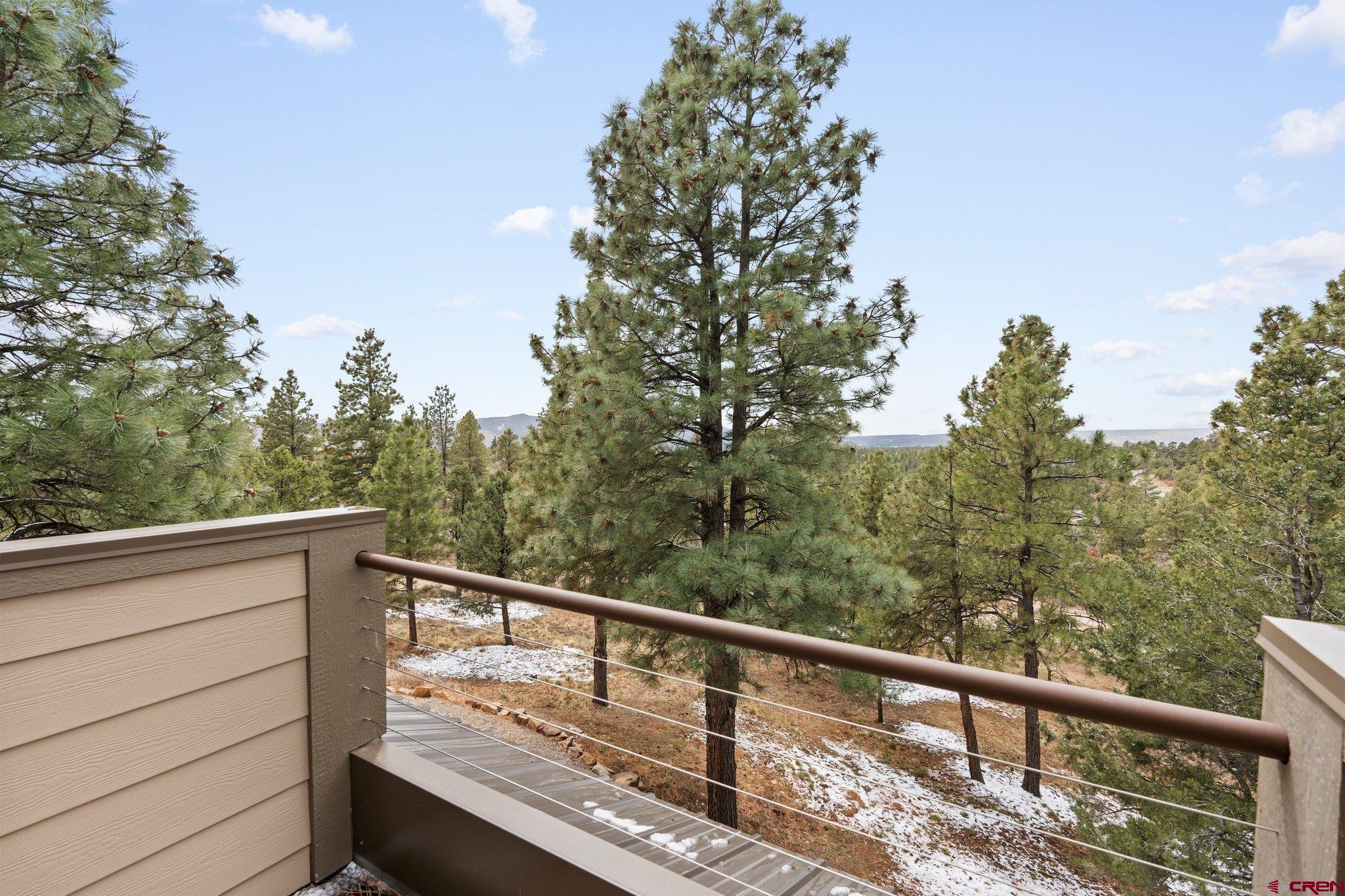 855 Ridge Road Durango, CO 81303 - Photo 27 of 35 a view of a balcony with wooden fence and floor