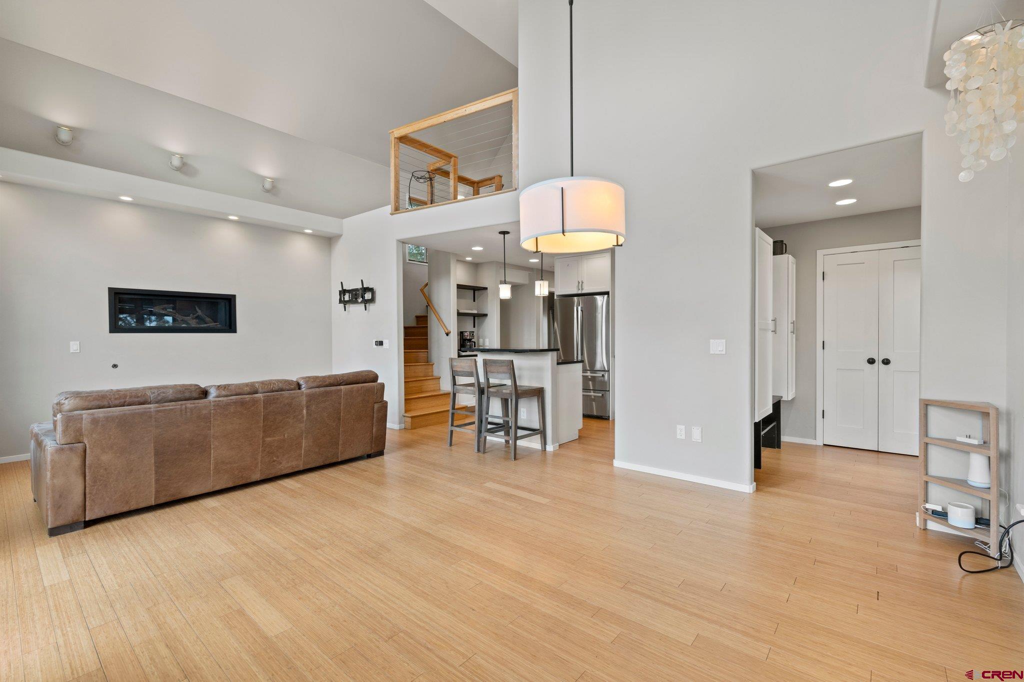 855 Ridge Road Durango, CO 81303 - Photo 4 of 35 a large room with furniture and a wooden floor