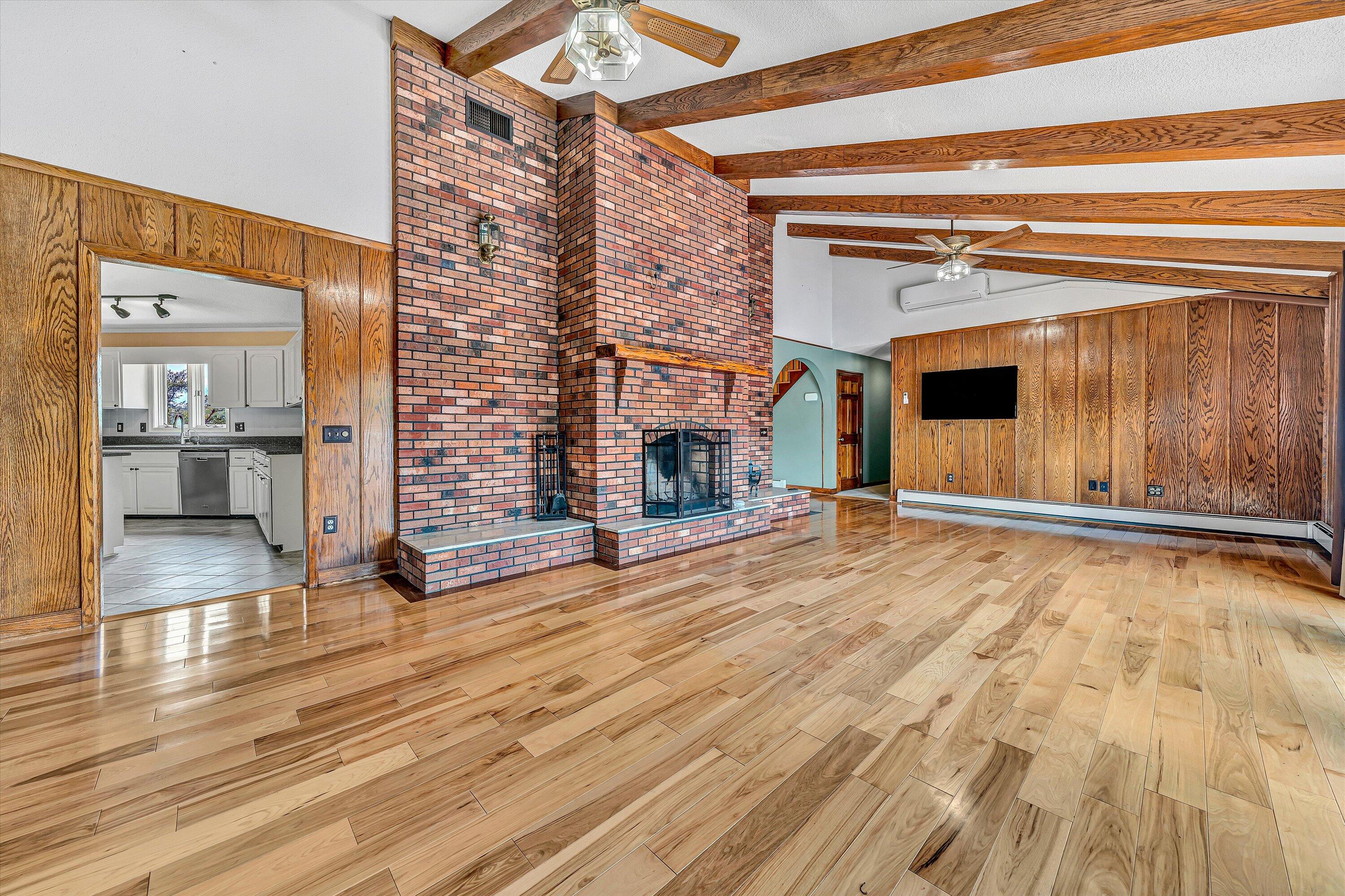 270 Parkside Lane Rocky Mount, VA 24151 - Photo 13 of 55 a view of a livingroom with wooden floor and a fireplace