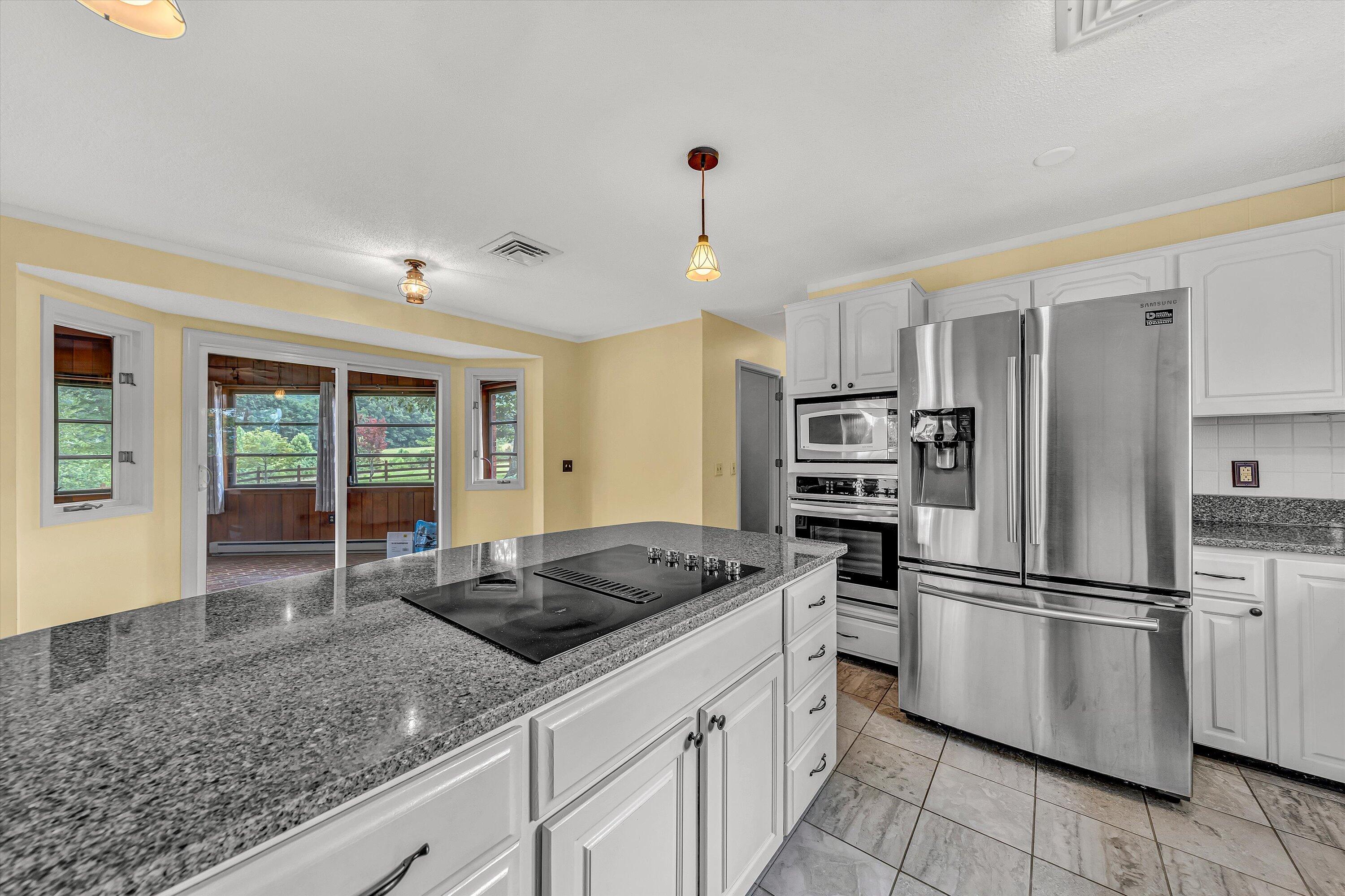 270 Parkside Lane Rocky Mount, VA 24151 - Photo 19 of 55 a kitchen with granite countertop a sink appliances and cabinets