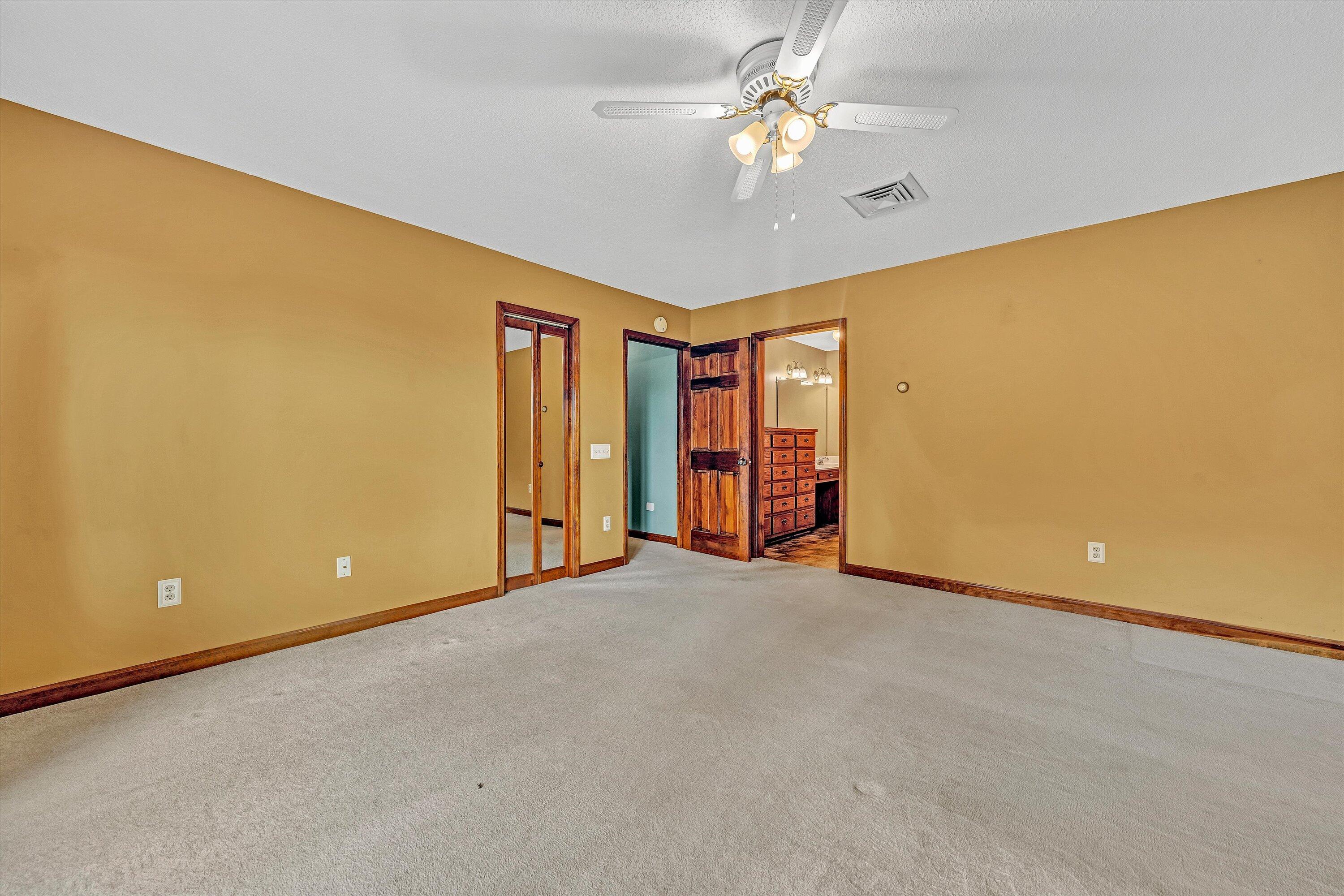 270 Parkside Lane Rocky Mount, VA 24151 - Photo 37 of 55 an empty room with chandelier fan and windows