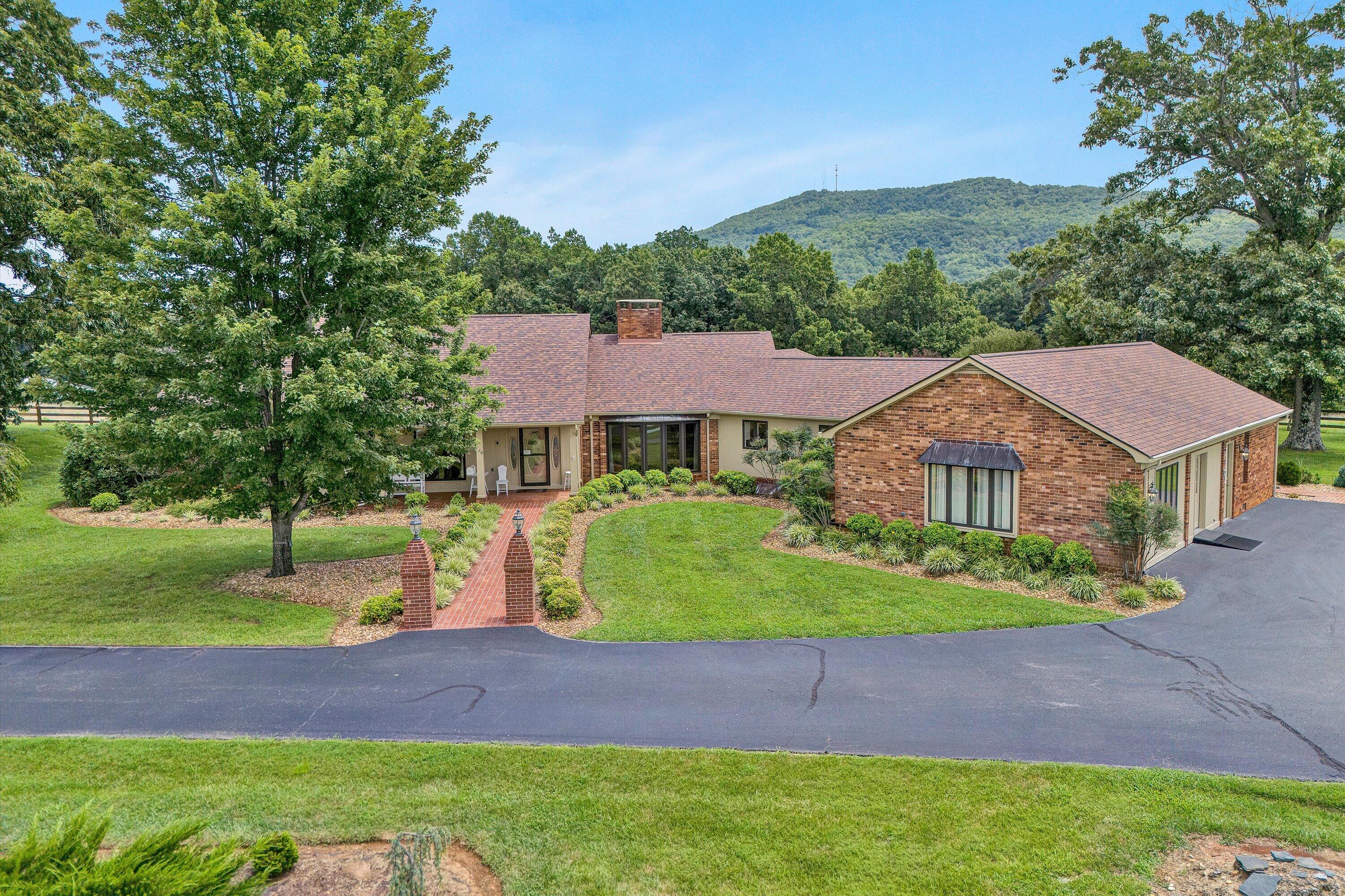 270 Parkside Lane Rocky Mount, VA 24151 - Photo 52 of 55 a front view of a house with a yard and garage