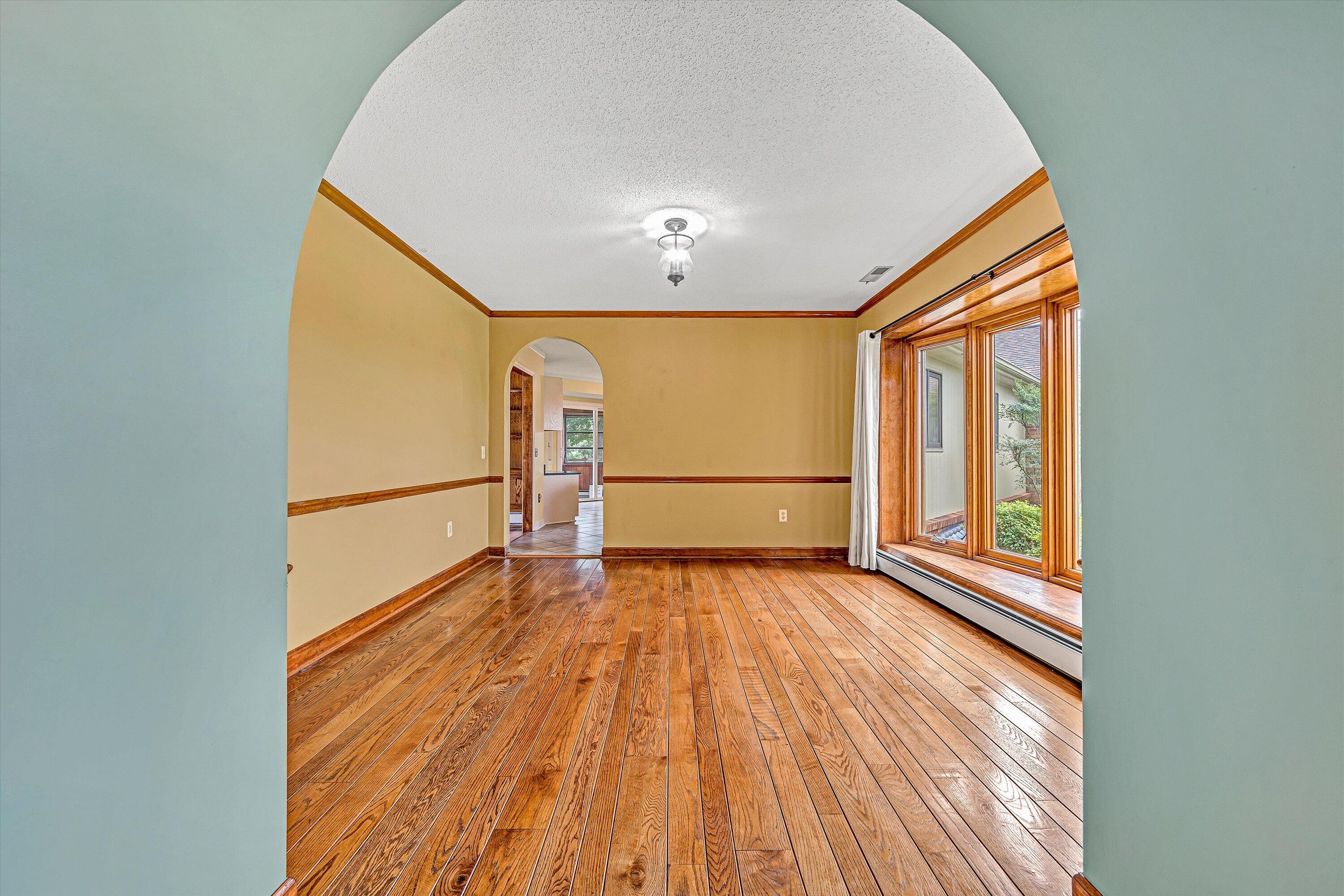 270 Parkside Lane Rocky Mount, VA 24151 - Photo 10 of 55 a view of an empty room with wooden floor and a window